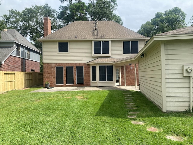 3210 Echo Mountain Dr, Houston, TX 77345 - back of property with a patio area, a shingled roof, brick siding, and a chimney