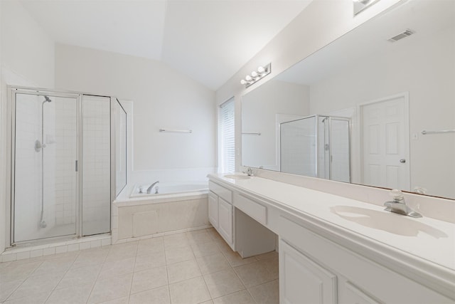 7314 Mountain Valley Dr, Houston, TX 77095 - bathroom with double vanity, vaulted ceiling, a bath, a shower stall, and tile patterned flooring