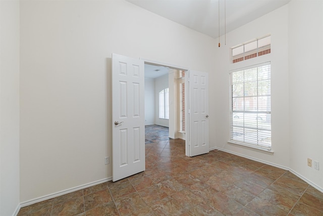 7314 Mountain Valley Dr, Houston, TX 77095 - spare room featuring stone finish floors and a high ceiling