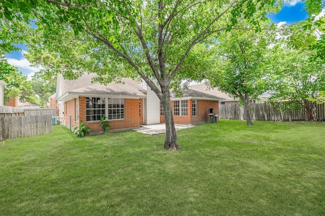 7314 Mountain Valley Dr, Houston, TX 77095 - rear view of house featuring brick siding, a fenced backyard, and a patio