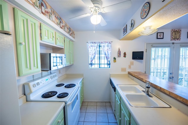 2110 Wilcrest Dr Unit 101, Houston, TX 77042 - kitchen with white appliances, green cabinets, and a ceiling fan