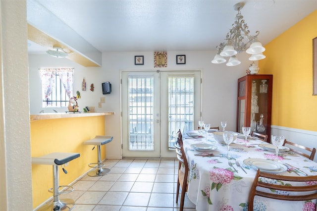 2110 Wilcrest Dr Unit 101, Houston, TX 77042 - dining room with tile patterned flooring and a chandelier