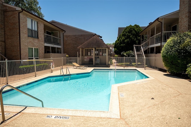2110 Wilcrest Dr Unit 101, Houston, TX 77042 - community pool featuring a patio and a gazebo