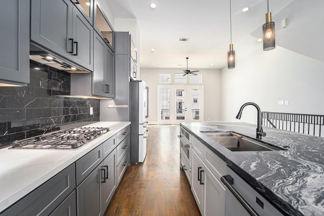 2221 Francis St, Houston, TX 77004 - kitchen featuring stainless steel gas stovetop, freestanding refrigerator, a ceiling fan, dishwasher, and dark wood-style flooring