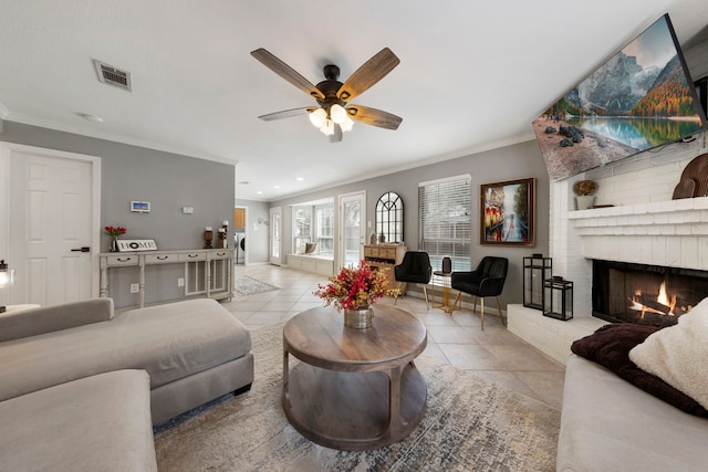 19 Shinyrock Pl, The Woodlands, TX 77381 - living area featuring tile patterned flooring, ceiling fan, ornamental molding, a fireplace, and recessed lighting
