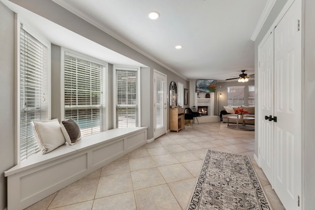19 Shinyrock Pl, The Woodlands, TX 77381 - hall featuring crown molding, light tile patterned flooring, plenty of natural light, and recessed lighting