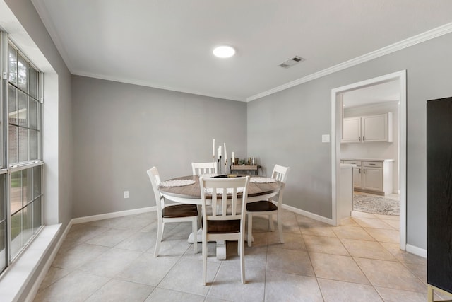 19 Shinyrock Pl, The Woodlands, TX 77381 - dining space featuring plenty of natural light, ornamental molding, and light tile patterned flooring