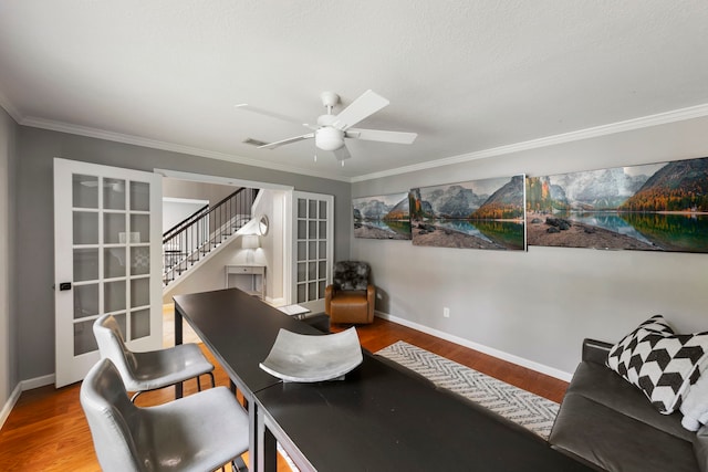 19 Shinyrock Pl, The Woodlands, TX 77381 - office area with wood finished floors, ceiling fan, and ornamental molding