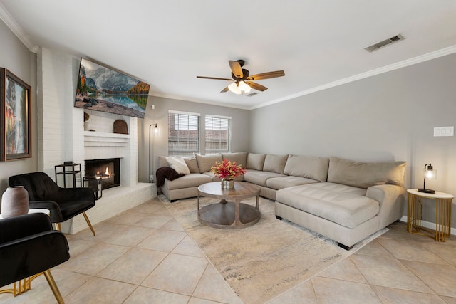 19 Shinyrock Pl, The Woodlands, TX 77381 - living area featuring crown molding, light tile patterned flooring, ceiling fan, and a brick fireplace
