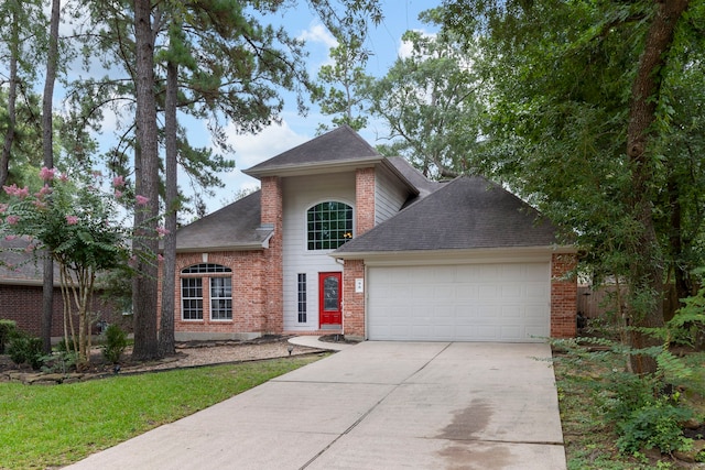 96 N Acacia Park Cir, The Woodlands, TX 77382 - traditional-style house featuring an attached garage, driveway, brick siding, and a shingled roof