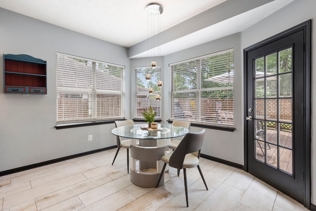 96 N Acacia Park Cir, The Woodlands, TX 77382 - dining room featuring baseboards and light wood finished floors