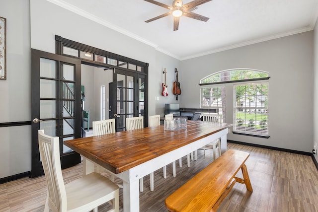 96 N Acacia Park Cir, The Woodlands, TX 77382 - dining area featuring ornamental molding, a ceiling fan, and light wood-type flooring