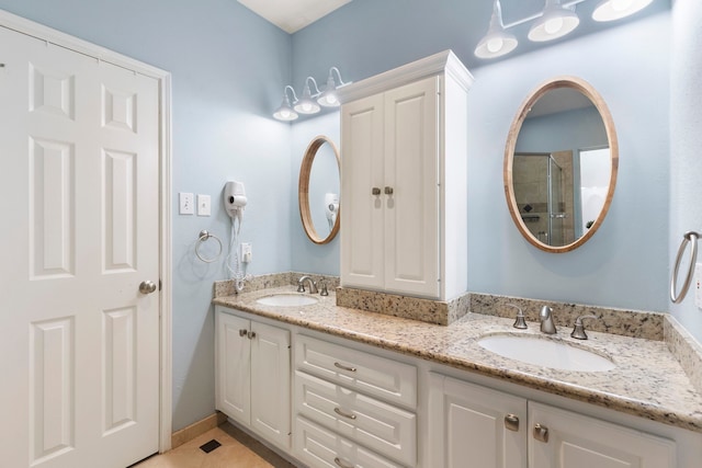 96 N Acacia Park Cir, The Woodlands, TX 77382 - bathroom featuring double vanity and tile patterned flooring