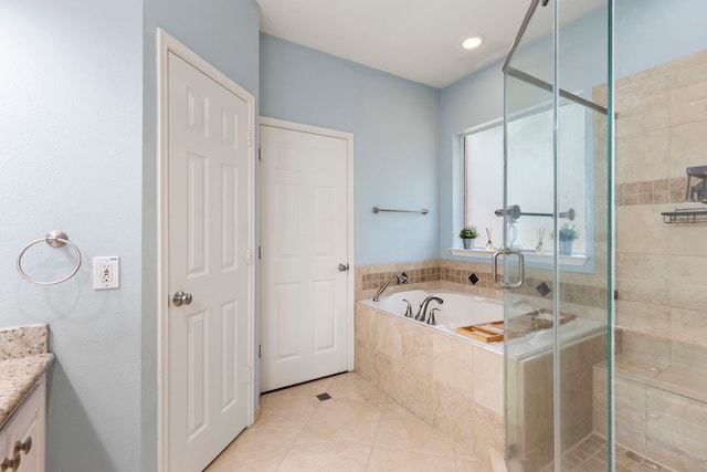 96 N Acacia Park Cir, The Woodlands, TX 77382 - bathroom featuring vanity, a garden tub, a stall shower, and tile patterned flooring