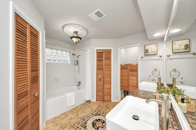 6803 Las Brisas Dr, Houston, TX 77083 - bathroom with a closet, tiled shower / bath combo, and vanity