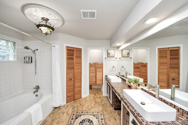 6803 Las Brisas Dr, Houston, TX 77083 - full bath featuring a closet, shower / bathtub combination with curtain, and double vanity