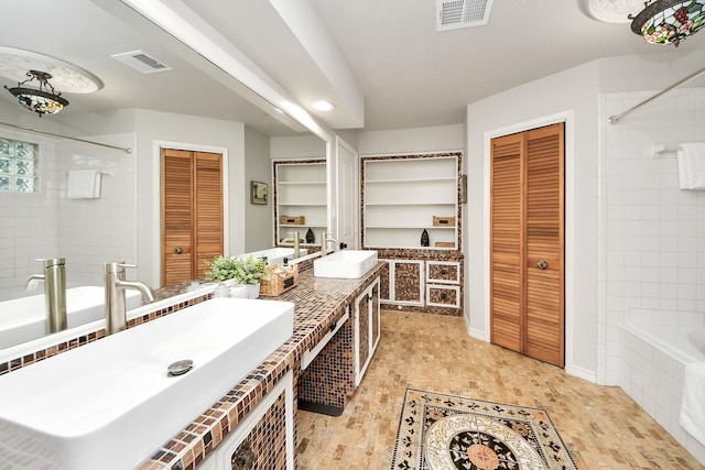 6803 Las Brisas Dr, Houston, TX 77083 - full bathroom featuring a closet, double vanity, and tiled shower / bath