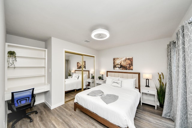 6803 Las Brisas Dr, Houston, TX 77083 - bedroom featuring wood finished floors and a closet