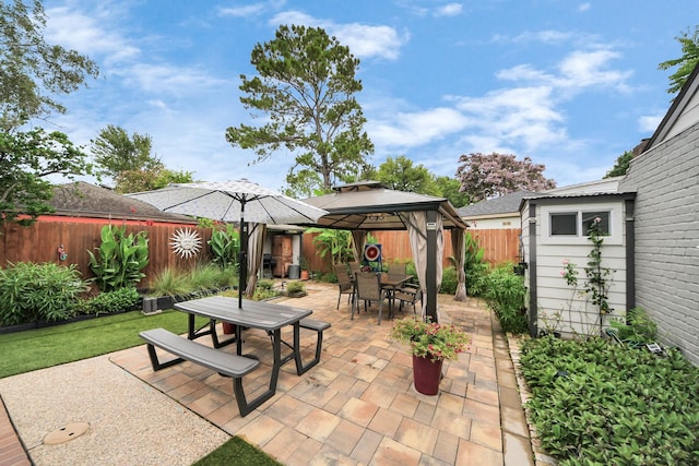 6803 Las Brisas Dr, Houston, TX 77083 - fenced backyard featuring outdoor dining area, a gazebo, a patio, and a shed