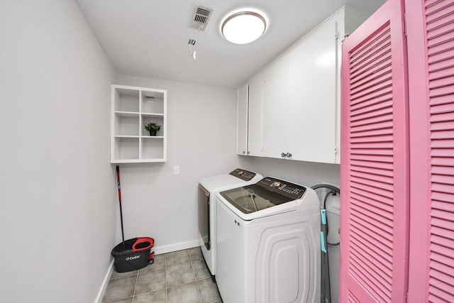 6803 Las Brisas Dr, Houston, TX 77083 - laundry area featuring cabinet space, separate washer and dryer, and light tile patterned floors