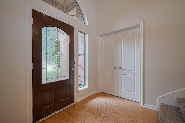 21002 Beech Landing Ln, Katy, TX 77450 - foyer entrance with healthy amount of natural light, light wood finished floors, and stairs