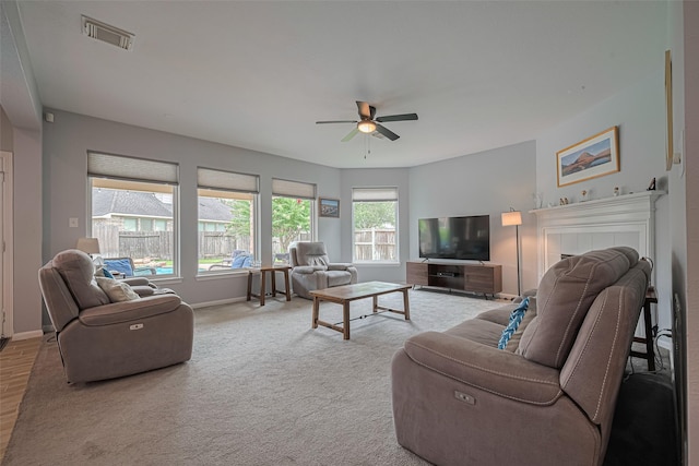 21002 Beech Landing Ln, Katy, TX 77450 - living room with ceiling fan and a tiled fireplace