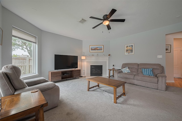 21002 Beech Landing Ln, Katy, TX 77450 - living area featuring ceiling fan, carpet, and a tile fireplace