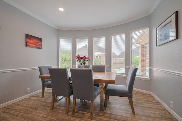 21002 Beech Landing Ln, Katy, TX 77450 - dining area featuring ornamental molding, wood finished floors, a textured wall, and recessed lighting
