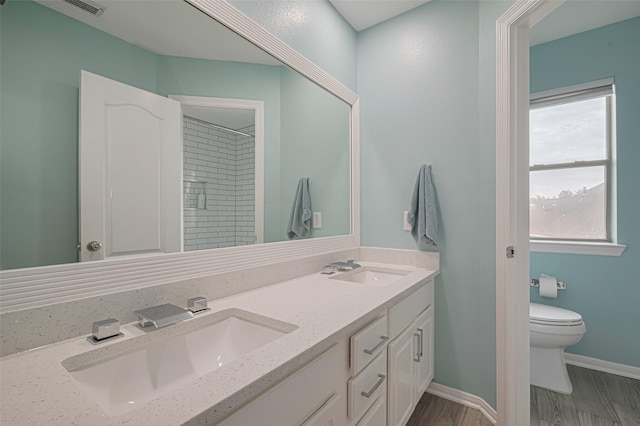 21002 Beech Landing Ln, Katy, TX 77450 - full bathroom with double vanity, a shower, and wood finished floors