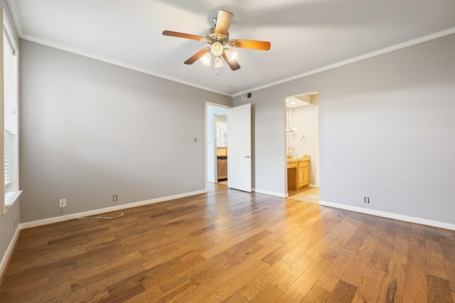 2829 Timmons Ln Unit 101, Houston, TX 77027 - unfurnished bedroom with light wood-type flooring, crown molding, multiple windows, connected bathroom, and ceiling fan