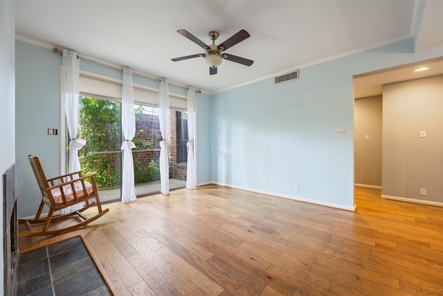 2829 Timmons Ln Unit 101, Houston, TX 77027 - empty room with a ceiling fan, hardwood / wood-style floors, and ornamental molding