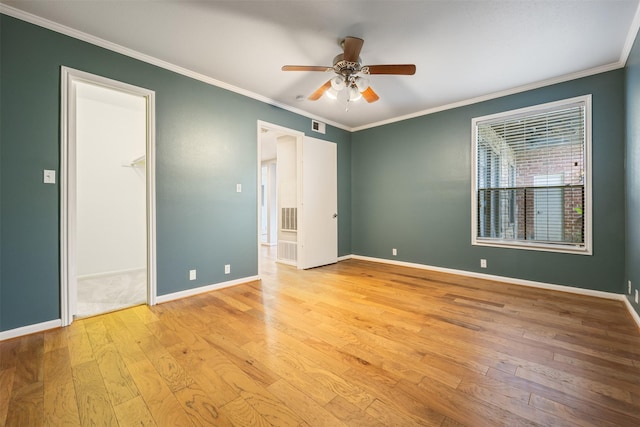 2829 Timmons Ln Unit 101, Houston, TX 77027 - unfurnished bedroom featuring wood-type flooring, ornamental molding, and ceiling fan