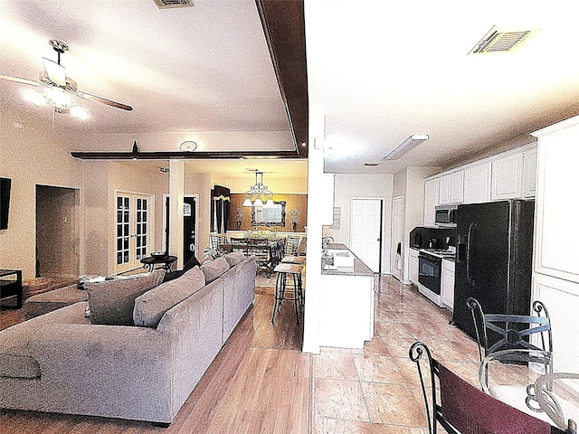 4134 Teal Valley Ct, Fresno, TX 77545 - living room featuring ceiling fan and light wood-style floors