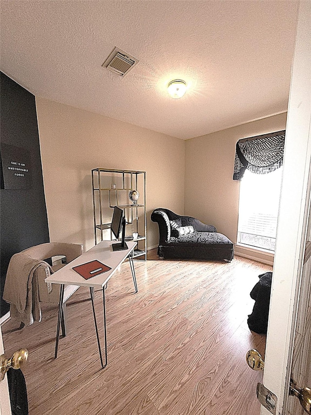 4134 Teal Valley Ct, Fresno, TX 77545 - bedroom featuring wood finished floors and a textured ceiling