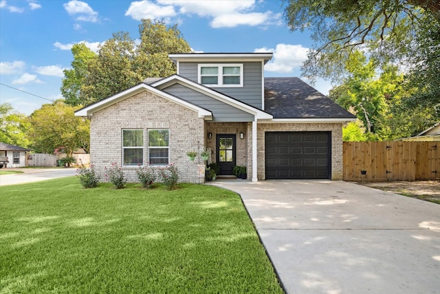 2201 Maple St, Liberty, TX 77575 - view of front facade with brick siding, an attached garage, and concrete driveway