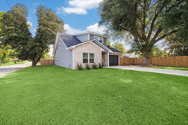 2201 Maple St, Liberty, TX 77575 - view of front of house with driveway, brick siding, a garage, and roof with shingles