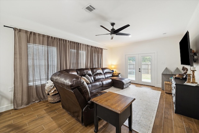 2201 Maple St, Liberty, TX 77575 - living room featuring ceiling fan, wood finished floors, and french doors