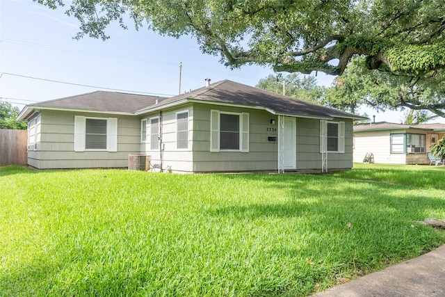 7734 El Rancho St, Houston, TX 77087 - view of front facade featuring a front yard and a shingled roof