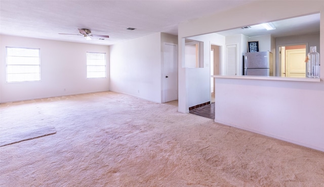 7734 El Rancho St, Houston, TX 77087 - carpeted empty room with a ceiling fan and baseboards
