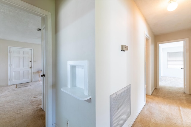 7734 El Rancho St, Houston, TX 77087 - hallway featuring carpet and baseboards