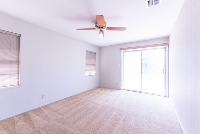 7734 El Rancho St, Houston, TX 77087 - empty room with light carpet and ceiling fan
