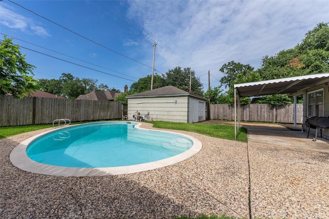 7734 El Rancho St, Houston, TX 77087 - view of pool featuring a patio area, a fenced backyard, and an outbuilding