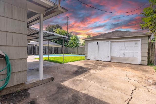 7734 El Rancho St, Houston, TX 77087 - garage at dusk featuring a detached garage