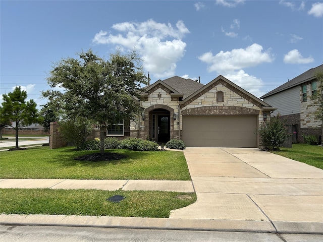 20130 New Sunrise Trl, Cypress, TX 77433 - french country inspired facade featuring stone siding, an attached garage, a front lawn, and concrete driveway