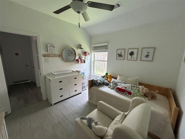 20130 New Sunrise Trl, Cypress, TX 77433 - bedroom with light wood finished floors, lofted ceiling, and ceiling fan
