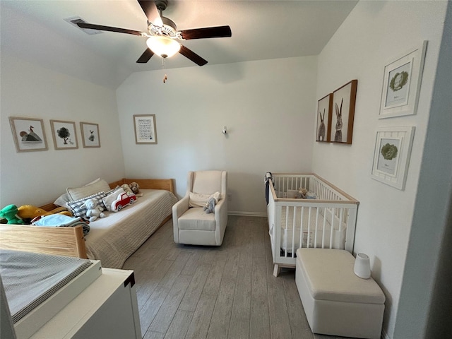 20130 New Sunrise Trl, Cypress, TX 77433 - bedroom with light wood finished floors and ceiling fan