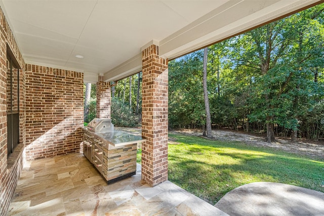 10332 Hunter Creek Ln, Conroe, TX 77304 - view of patio / terrace featuring area for grilling and view of wooded area