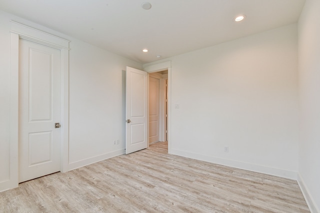 2717 Oakwood Crest Ln, Houston, TX 77018 - unfurnished bedroom with wood finished floors and recessed lighting