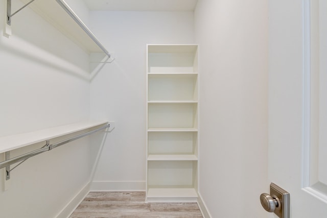 2717 Oakwood Crest Ln, Houston, TX 77018 - walk in closet with light wood-style flooring