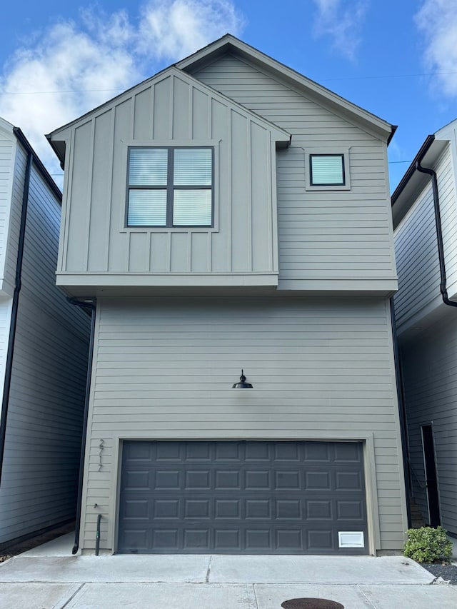 2717 Oakwood Crest Ln, Houston, TX 77018 - view of front of home featuring a garage and board and batten siding